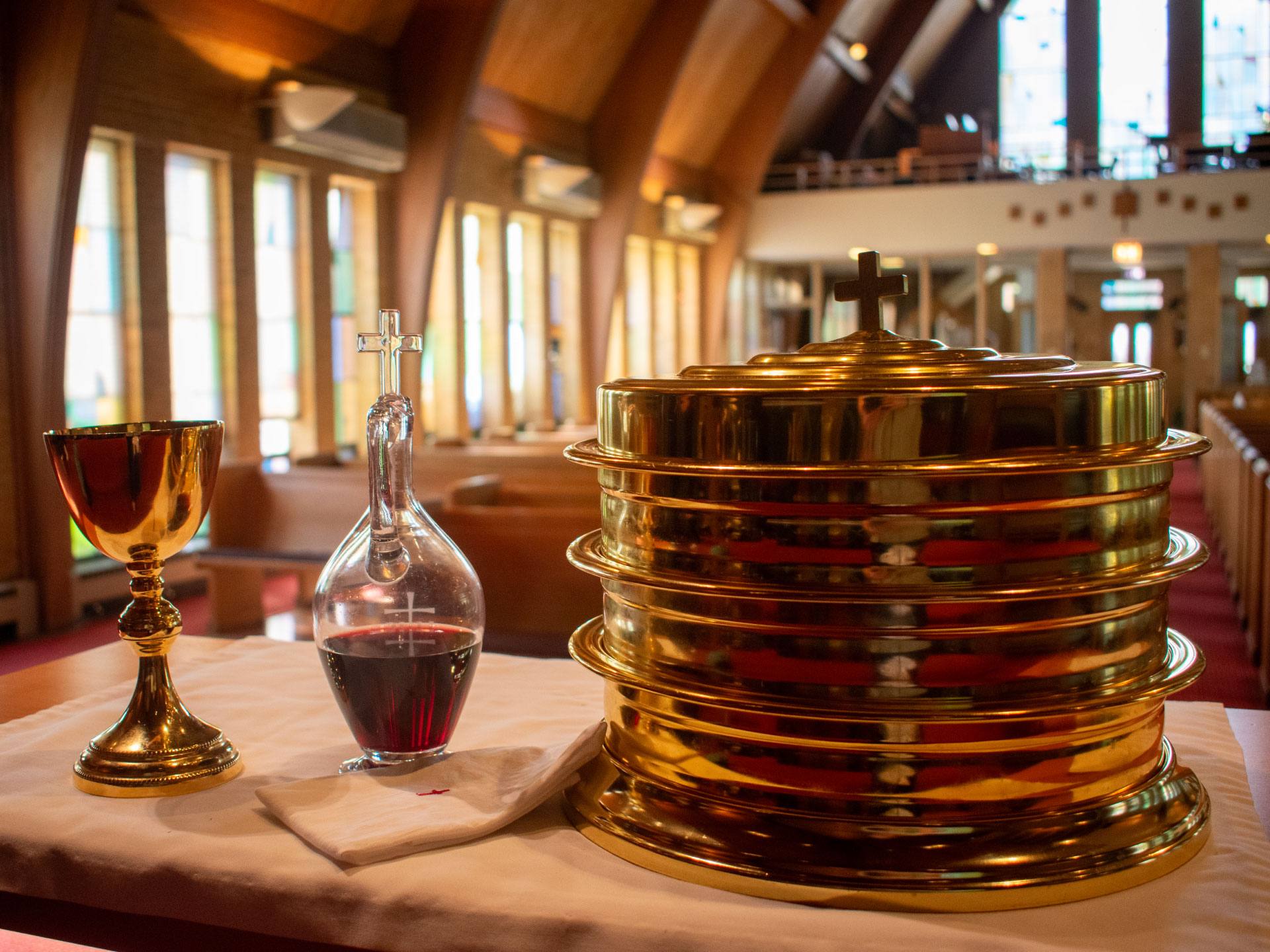 Communion chalice, wine and bread plates on the altar at Redeemer